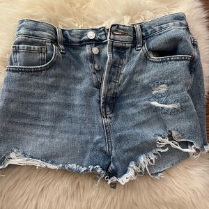 Light wash short ripped jeans mid rise with multiple buttons